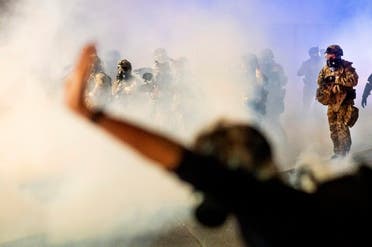 Federal officers use chemical irritants and projectiles to disperse Black Lives Matter protesters at the Mark O. Hatfield United States Courthouse on Friday, July 24, 2020, in Portland, Ore. Since federal officers arrived in downtown Portland in early July, violent protests have largely been limited to a two block radius from the courthouse. (AP)