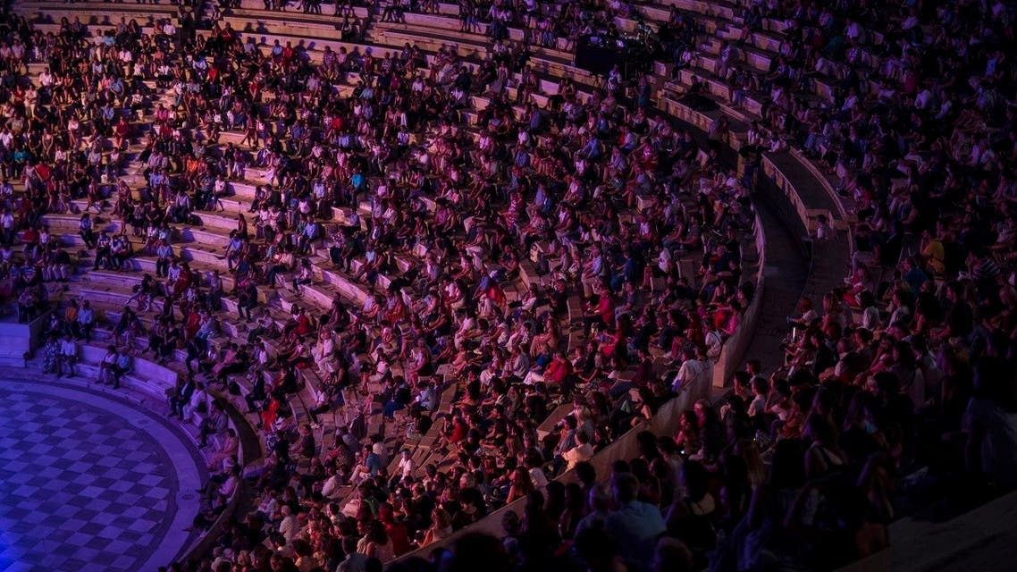 Spectators sit at the Odeon of Herodes Atticus in Athens, during a concert on Wednesday, July 15, 2020. (AP)