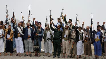 Tribesmen loyal to the Houthi group wave up their weapons as they shout slogans during a gathering of Houthi loyalists on the outskirts of Sanaa, Yemen July 8, 2020. REUTERS/Khaled Abdullah