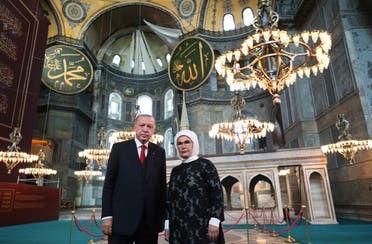 Turkey's President Recep Tayyip Erdogan, accompanied by his wife Emine, poses for photographs as he visits the Byzantine-era Hagia Sophia, in Istanbul on July 23, 2020. (AP)