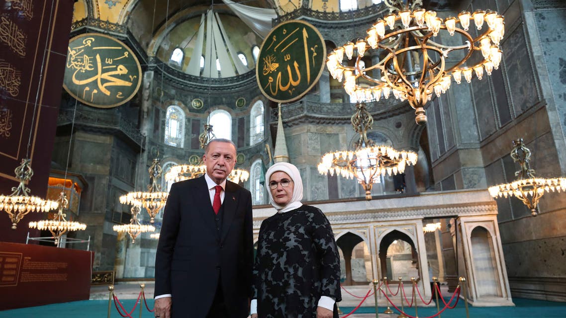 Turkey's President Recep Tayyip Erdogan, accompanied by his wife Emine, poses for photographs as he visits the Byzantine-era Hagia Sophia, in Istanbul on July 23, 2020. (AP)