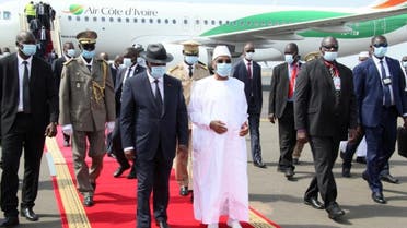 Mali’s President Ibrahim Boubacar Keita walks with his Ivory Coast counterpart Alassane Ouattara upon his arrival in Bamako, Mali, on July 23, 2020. (Reuters)
