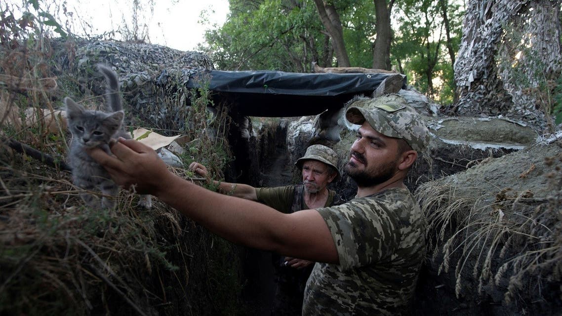 Ukrainian servicemen are seen at a position on the front line near the town of Novotoshkivske in Luhansk region, Ukraine, on July 26, 2020. (Reuters)