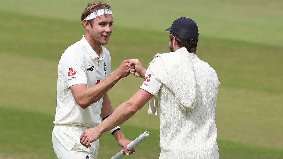 England’s Stuart Broad celebrates winning the test series with England’s Chris Woakes, as play resumes behind closed doors following the outbreak of the coronavirus disease. (Reuters)
