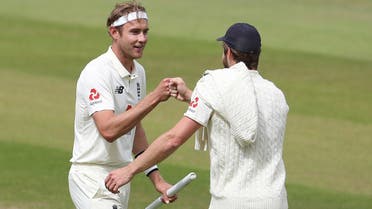  England’s Stuart Broad celebrates winning the test series with England’s Chris Woakes, as play resumes behind closed doors following the outbreak of the coronavirus disease. (Reuters)