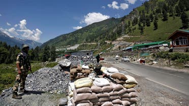 India’s Border Security Force (BSF) soldiers stand guard at a checkpoint along a highway leading to Ladakh, at Gagangeer in Kashmir's Ganderbal district on June 17, 2020. (Reuters)