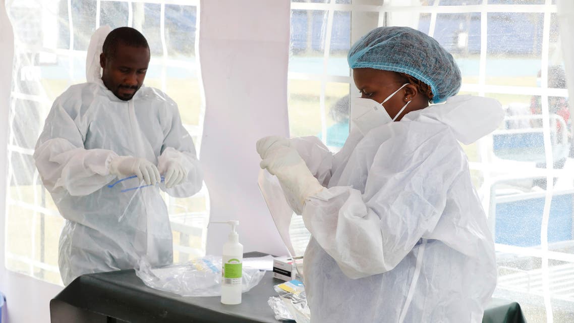FILE PHOTO: Nurse Beryl Negesa wears a protective suit before entering a field hospital built in Machakos, as the number of confirmed coronavirus disease (COVID-19) cases continues to rise in Kenya, July 23, 2020. Picture taken July 23, 2020. REUTERS/Baz Ratner/File Photo
