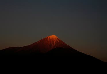 The morning sun shines on the summit of Mount Damavand, 109 km (68 miles) northeast of Tehran August 13, 2007. (Reuters)