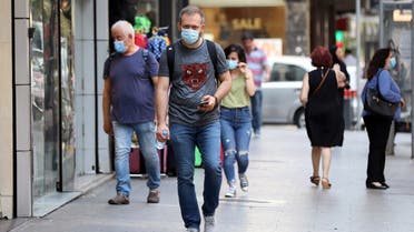 People walk as they wear face masks to prevent the spread of the coronavirus disease (COVID-19) in Beirut, Lebanon July 28, 2020. (Reuters)
