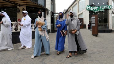 Saudi women walk in Abha High City, as the summer season kicks off with health precautions amid the coronavirus disease (COVID-19) outbreak. (Reuters)