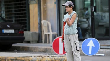 A file photo shows a street child shows a burn on his arm as he begs for money in a street of the Lebanese capital Beirut. (AFP)