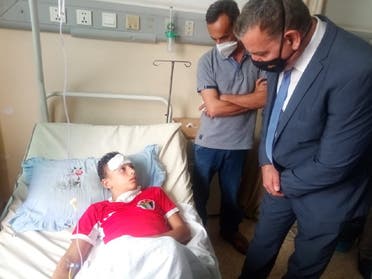 Jordanian Health Minister Saad Jaber visits food poisoning patients at a hospital. (Twitter)