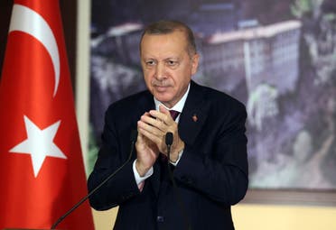 Turkey's President Recep Tayyip Erdogan applauds during a conference in Istanbul on July 28, 2020. (AP)