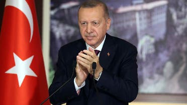 Turkey's President Recep Tayyip Erdogan applauds during a conference in Istanbul on July 28, 2020. (AP)