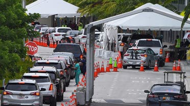 In this file photo taken on July 22, 2020 cars line up for Covid-19 test at a “walk-in” and “drive-through” coronavirus testing site in Miami Beach, Florida. (AFP)