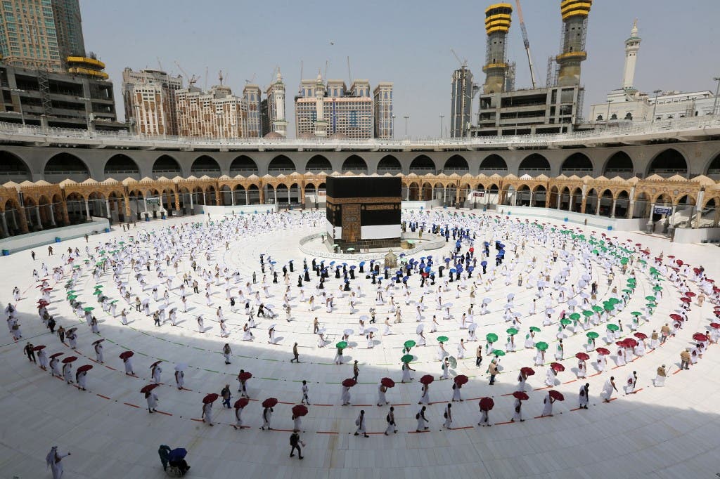A picture taken on July 29, 2020 shows pilgrims while social distancing as a coronavirus preventative measure while circumambulating around the Kaaba, Islam's holiest shrine, at the centre of the Grand Mosque in the holy city of Mecca, at the start of the annual Muslim Hajj pilgrimage. (AFP)