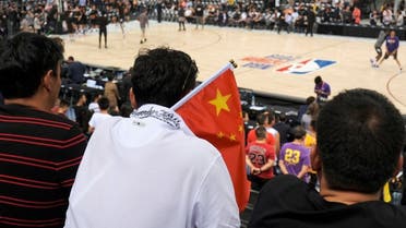 A fan carries a Chinese national flag during an NBA game in China in 2019. (File Photo: Reuters)
