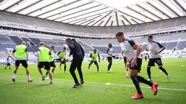 Newcastle United players warm up prior to the English Premier League football match between Newcastle United and Liverpool at St James' Park in Newcastle-upon-Tyne, north east England. (AFP)