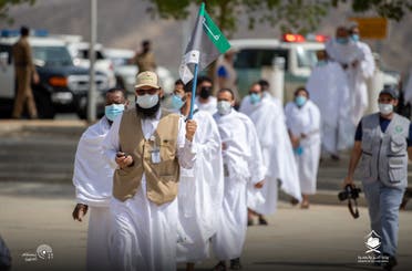 A file photo of mask-clad pilgrims making their way to Mount Arafat, in 2020. (Twitter)