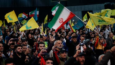 Hezbollah and Iran flags are seen during a rally to commemorate the 40th anniversary of Iran's Islamic Revolution, in southern Beirut. (File Photo: AP)