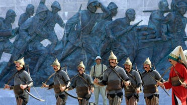 Turkish soldiers wearing Ottoman soldiers outfits march past the Gallipoli war memorial on April 24, 2006. (AP)