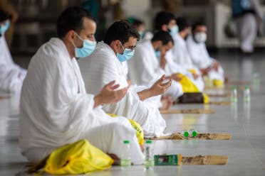 Muslim pilgrims wearing protective face masks pray at the Grand mosque during the annual Haj pilgrimage amid the coronavirus pandemic, in the holy city of Mecca, Saudi Arabia, July 29, 2020. (SPA via Reuters)