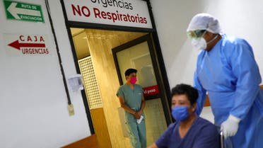 A nurse looks on as Hugo, a patient who has recovered from the coronavirus disease (COVID-19), leaves from the Juarez Hospital to go to his house in Mexico City, Mexico, July 27, 2020. REUTERS/Edgard Garrido