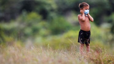 An Indigenous child from Yanomami ethnic group is seen, amid the spread of the coronavirus disease (COVID-19), at the 4th Surucucu Special Frontier Platoon of the Brazilian army in the municipality of Alto Alegre, state of Roraima, Brazil July 1, 2020. (Reuters)