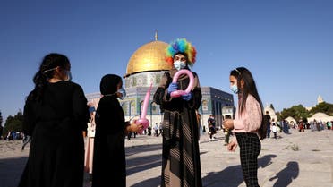 Palestinians celebrate Eid al-Adha holiday under virus restrictions in Jerusalem. (Reuters)