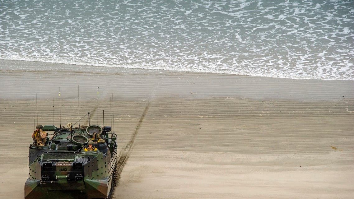 000_1W320AAmphibious Assault Vehicles with 3rd Assault Amphibian Battalion, land with US Marines from 1st Battalion, 1st Marine Regiment, during the US -JAPAN military exercise Iron Fist 2014 outside the USMC base in Camp Pendleton, Calfornia. (AFP)