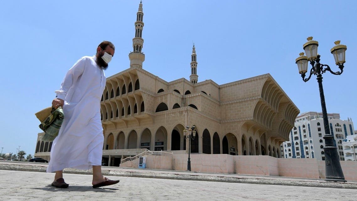 A worshipper leaves a mosque following players in the emirate of Sharjah after the United Arab Emirates reopened places of worship. (AFP)