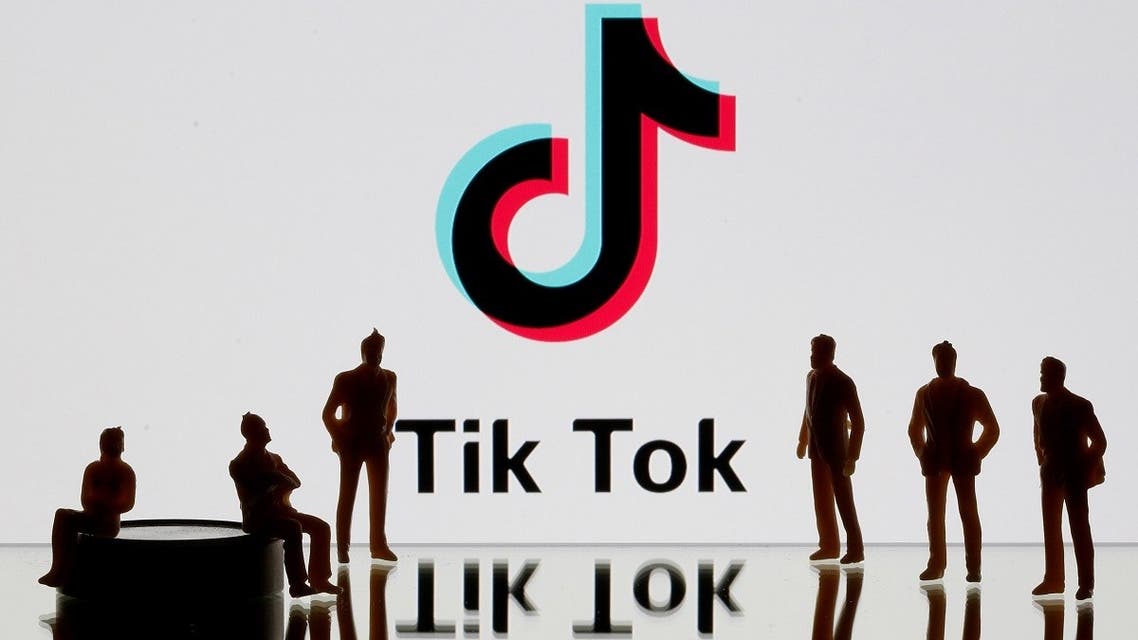 A 3-D printed figures are seen in front of displayed Tik Tok logo in this picture illustration. (Reuters)