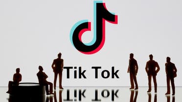 A 3-D printed figures are seen in front of displayed Tik Tok logo in this picture illustration. (Reuters)