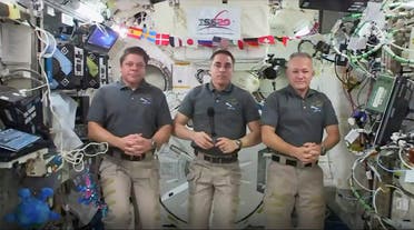 This photo provided by NASA shows from left, astronauts Bob Behnken, Chris Cassidy and Doug Hurley during an interview on the International Space Station on Friday, July 31, 2020. (AP)
