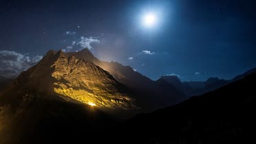 The mountain chains of Veisivi and Dent de Perroc are illuminated by 100 kg of the magnesium powder to celebrate Swiss National Day following the coronavirus disease (COVID-19) outbreak in Ferpecle near Evolene in the Val d’Herens, Switzerland July 31, 2020. (Reuters)