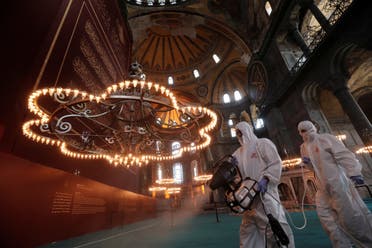 Fatih Municipality workers in protective suits disinfect Hagia Sophia Grand Mosque on the eve of the Muslim festival of Eid al-Adha, to prevent the spread of the coronavirus disease (COVID-19), in Istanbul, Turkey, July 30, 2020. (Reuters)