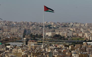 A picture taken on April 27, 2020, shows the Jordanian flying waving in the wind over the capital Amman. (AFP)