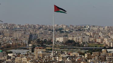 A picture taken on April 27, 2020, shows the Jordanian flying waving in the wind over the capital Amman. (AFP)