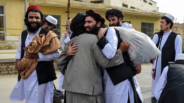 Taliban prisoners great each other as they are in the process of being potentially released from Pul-e-Charkhi prison, on the outskirts of Kabul on July 31, 2020. (AFP)