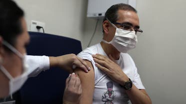 A nurse administers China's SinoVac coronavirus potential vaccine to volunteer and doctor Ivan Franca at Emilio Ribas Institute in Sao Paulo, Brazil July 30, 2020. REUTERS/Amanda Perobelli