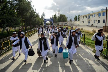 Taliban prisoners walk as they are in the process of being potentially released from Pul-e-Charkhi prison, on the outskirts of Kabul on July 31, 2020. (AFP)