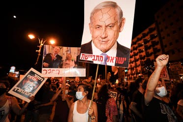 Protesters chant slogans during a demonstration of thousands against the Israeli government near the Netanyahu's residence in Jerusalem on August 2, 2020. (AFP)