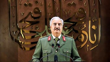 This image grab taken from a video published by the War Information Division of military strongman Khalifa Haftar's self-proclaimed Libyan National Army (LNA) on April 28, 2020 shows Haftar giving a speech, saying he had a popular mandate to govern the country, declaring a key 2015 political deal over and vowing to press his assault to seize Tripoli. In a speech on his Libya al-Hadath TV channel, Haftar said his self-styled Libyan army was proud to be mandated with the historic task of leading Libya. He did not make clear whether an elected parliament in the country's east, a signatory to the deal, backed his move -- or what its future role would be. Haftar has so far drawn his legitimacy from the administration based in the country's east, and last April his forces launched an assault to seize the capital Tripoli, in the west, from the Government of National Accord.