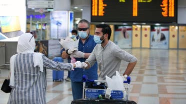 Travellers arrive at Kuwait international Airport, in Farwaniya, about 15kms south of Kuwait City, on August 1, 2020. (AFP)