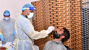A man is tested at a COVID-19 testing center in Dibba Fujairah, UAE. (WAM)
