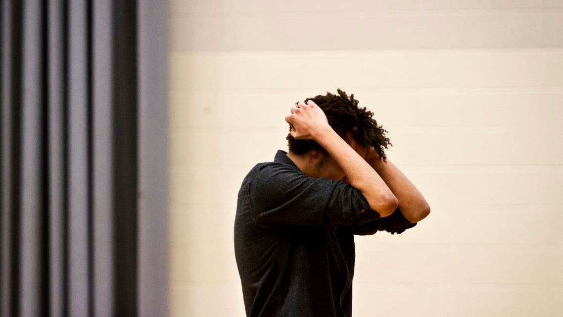 A man holds his head. (File photo: Reuters)