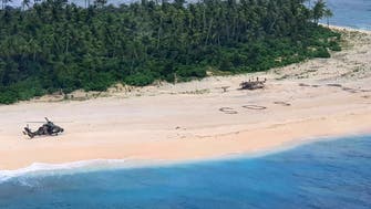 Three men who wrote SOS in sand rescued from Pacific island