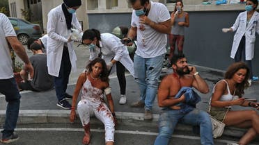 Wounded people are pictured outside a hospital following an explosion in the Lebanese capital Beirut on August 4, 2020. (AFP)