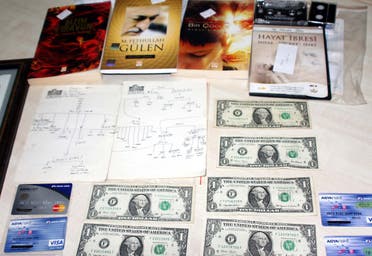 US dollars, Visas cards and books displayed after police raids on the home and the business of one suspected follower of Muslim cleric Fethullah Gulen in Gaziantep, Turkey on Aug 3, 2016. (AP)