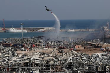 An army helicopter drops water at the scene of Tuesday's massive explosion that hit the seaport of Beirut on August 5, 2020. (AP)